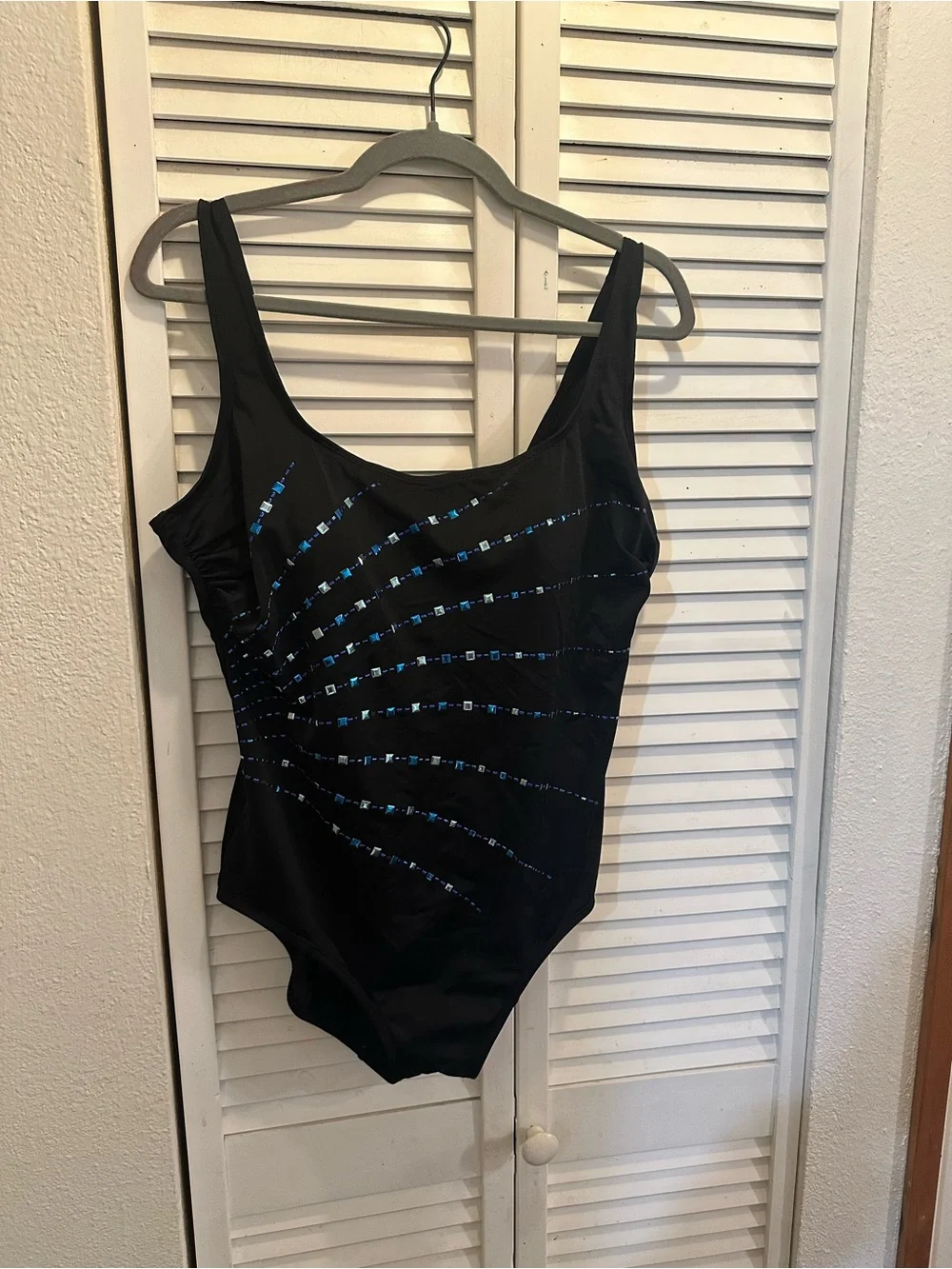 Black One-Piece Swimsuit with Blue Sequin Accent